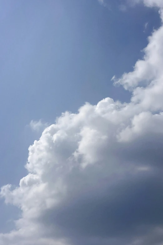 two airplanes in the sky with white clouds