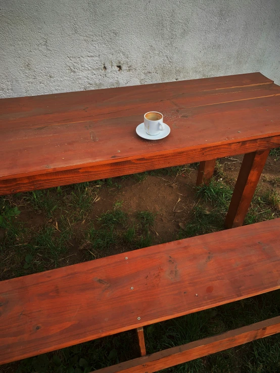 a wooden table with an empty plate on it