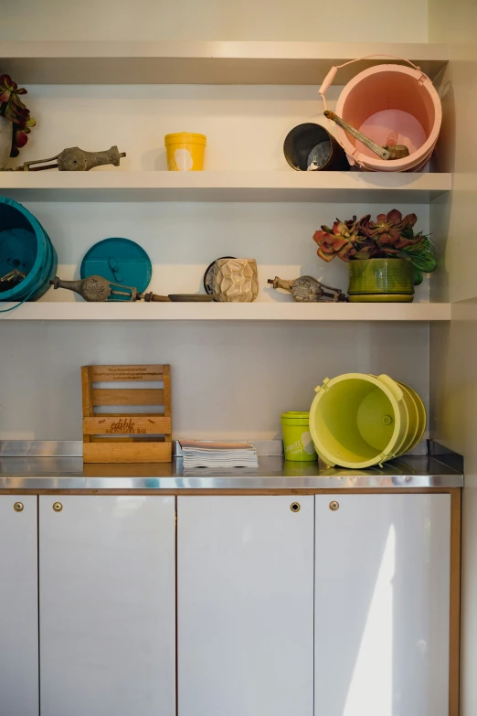 a cabinet with a shelf and bowls, plates and bowls