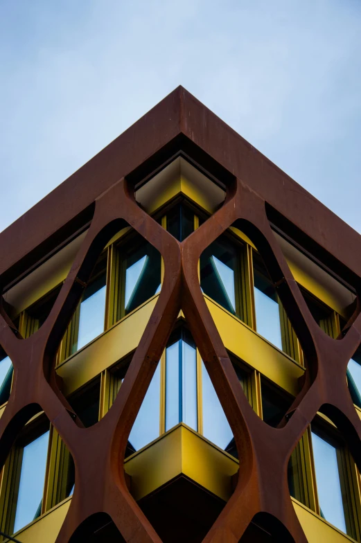 the building is made of wood and has triangular shapes