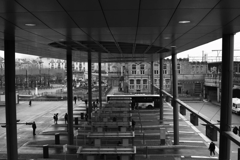 a large open area with some benches and people standing on it