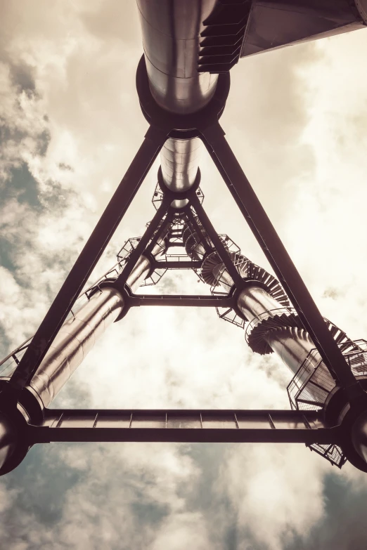 view from underneath of a large metal structure in the sky