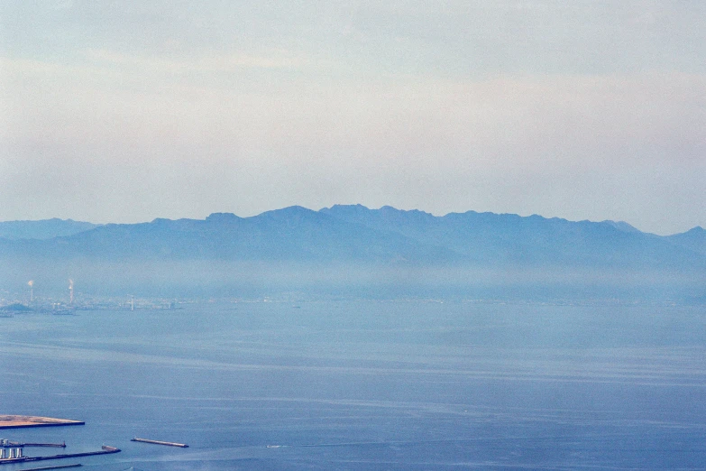 a water plane flying over a large body of water