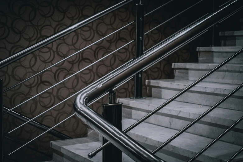 an iron railing is on the bottom of a staircase