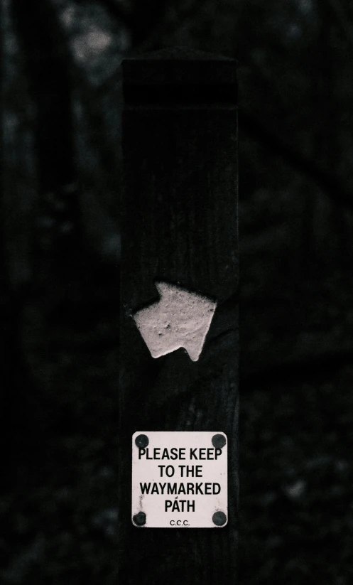 a sign on the side of a metal pole