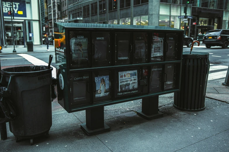 a public bench has a bunch of posters on it