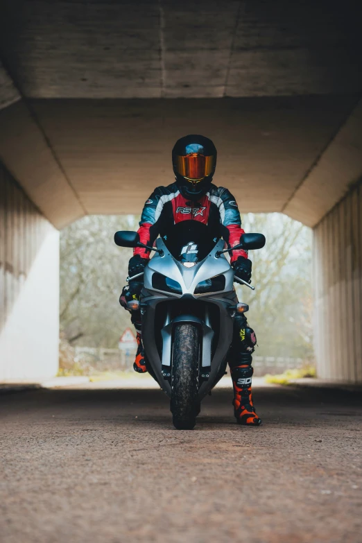 a man is riding on the back of a motorcycle