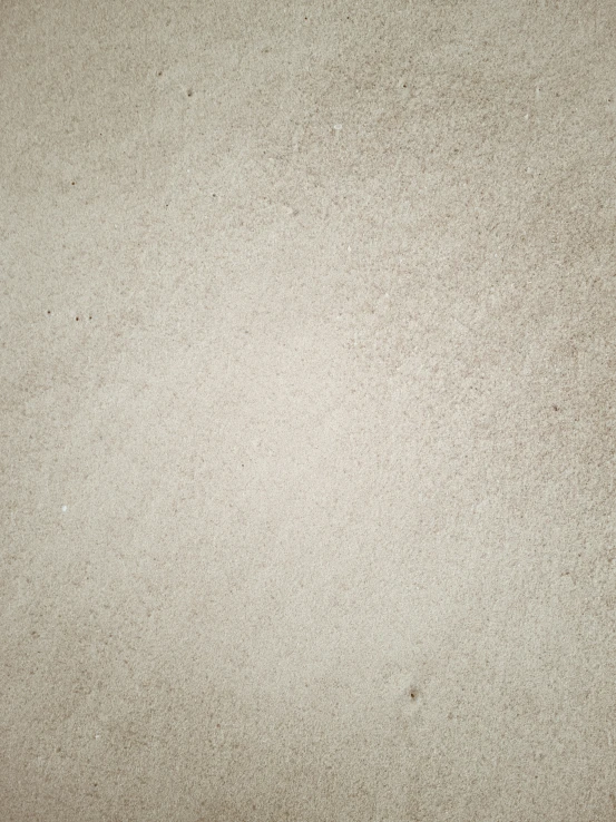 a group of rocks sitting on top of a sandy beach