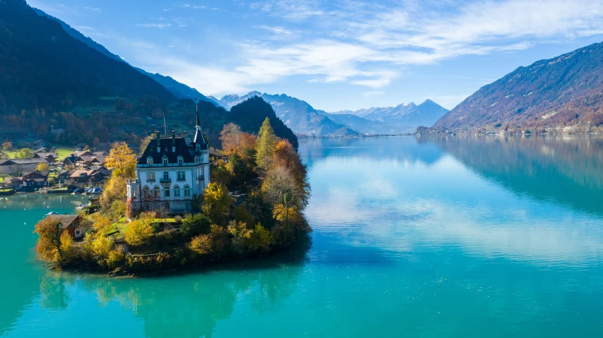 an island with some trees on the water