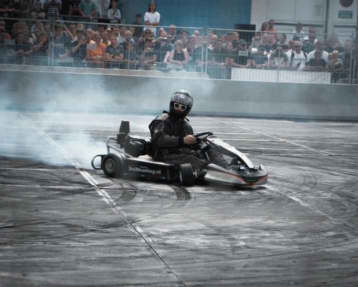 a man is sitting on a hover while smoke burns