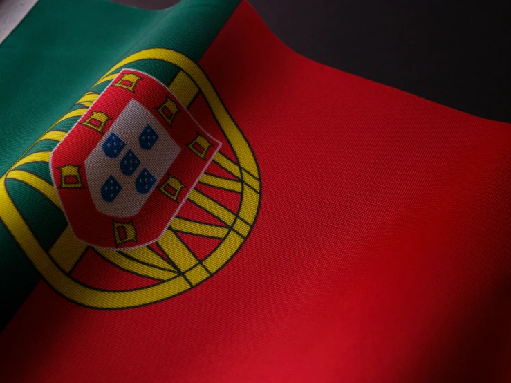 a flag that has been folded in the colors of portugal and black