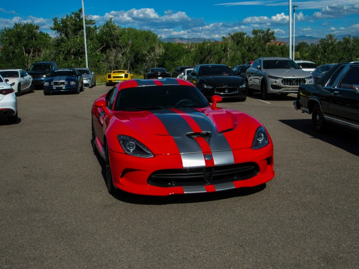 an exotic sports car is parked in the lot