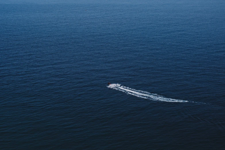 a boat in the middle of the ocean