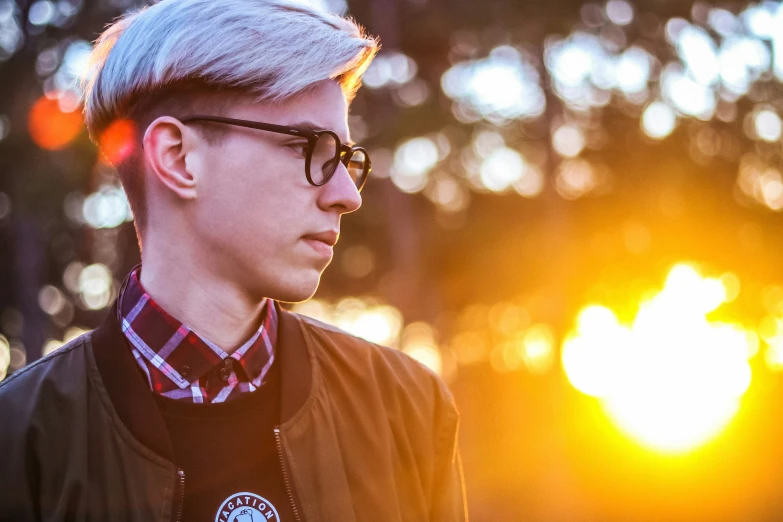 man wearing black and white checkered shirt staring away