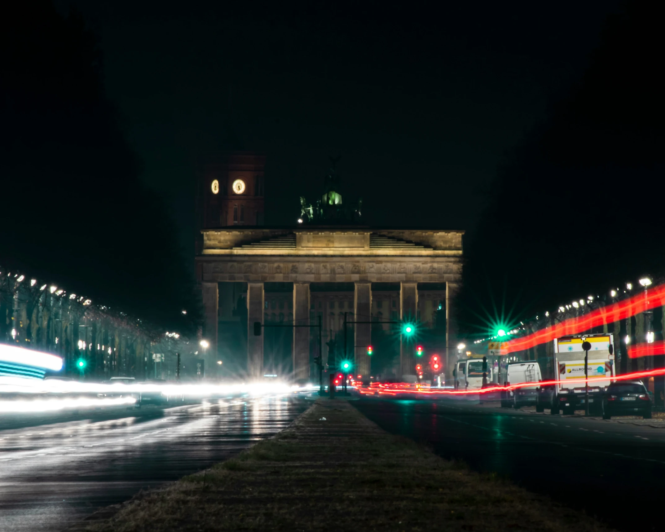 lights are streaking down the road and traffic on the street