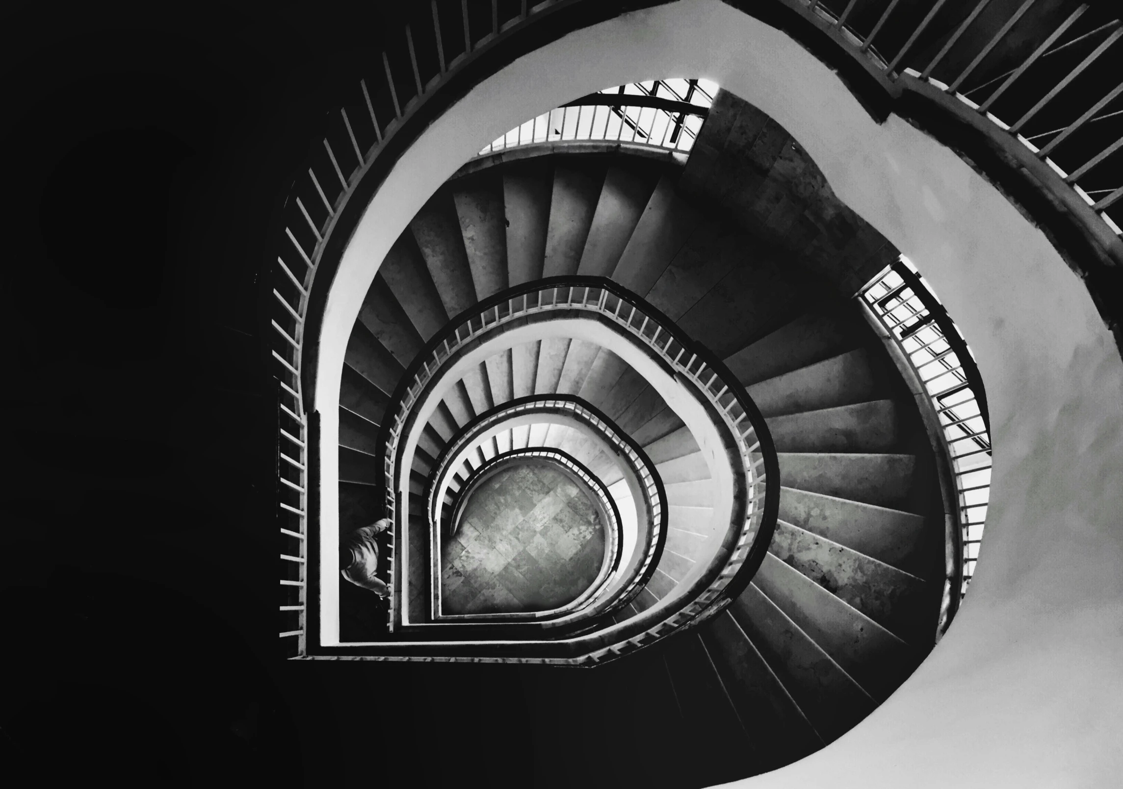 a black and white po of a spiral staircase