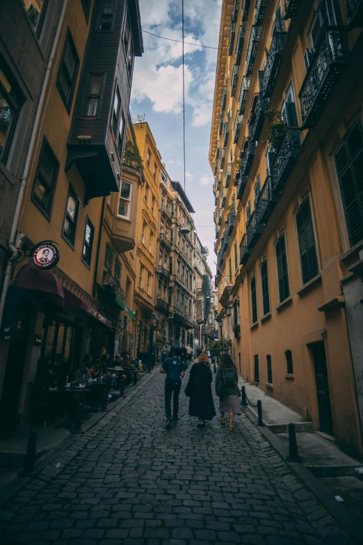 a group of people standing in an alley