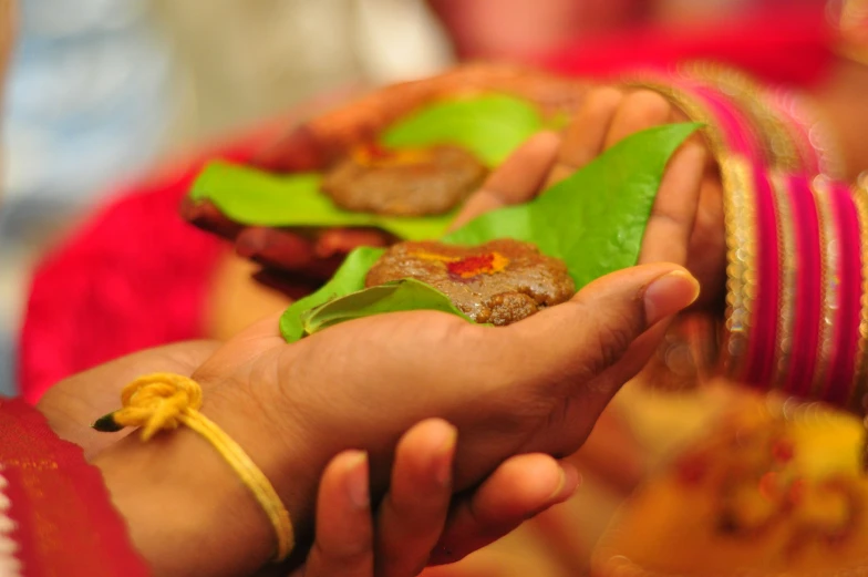 a bunch of people that are holding some food