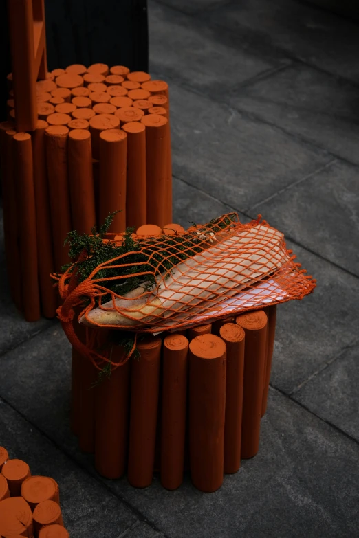 a pile of orange poles that have been placed together