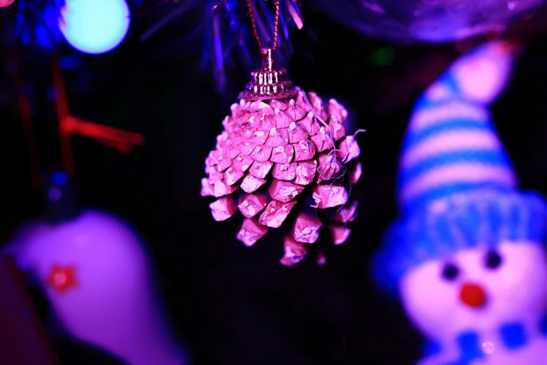 a couple of ornaments hanging from a christmas tree