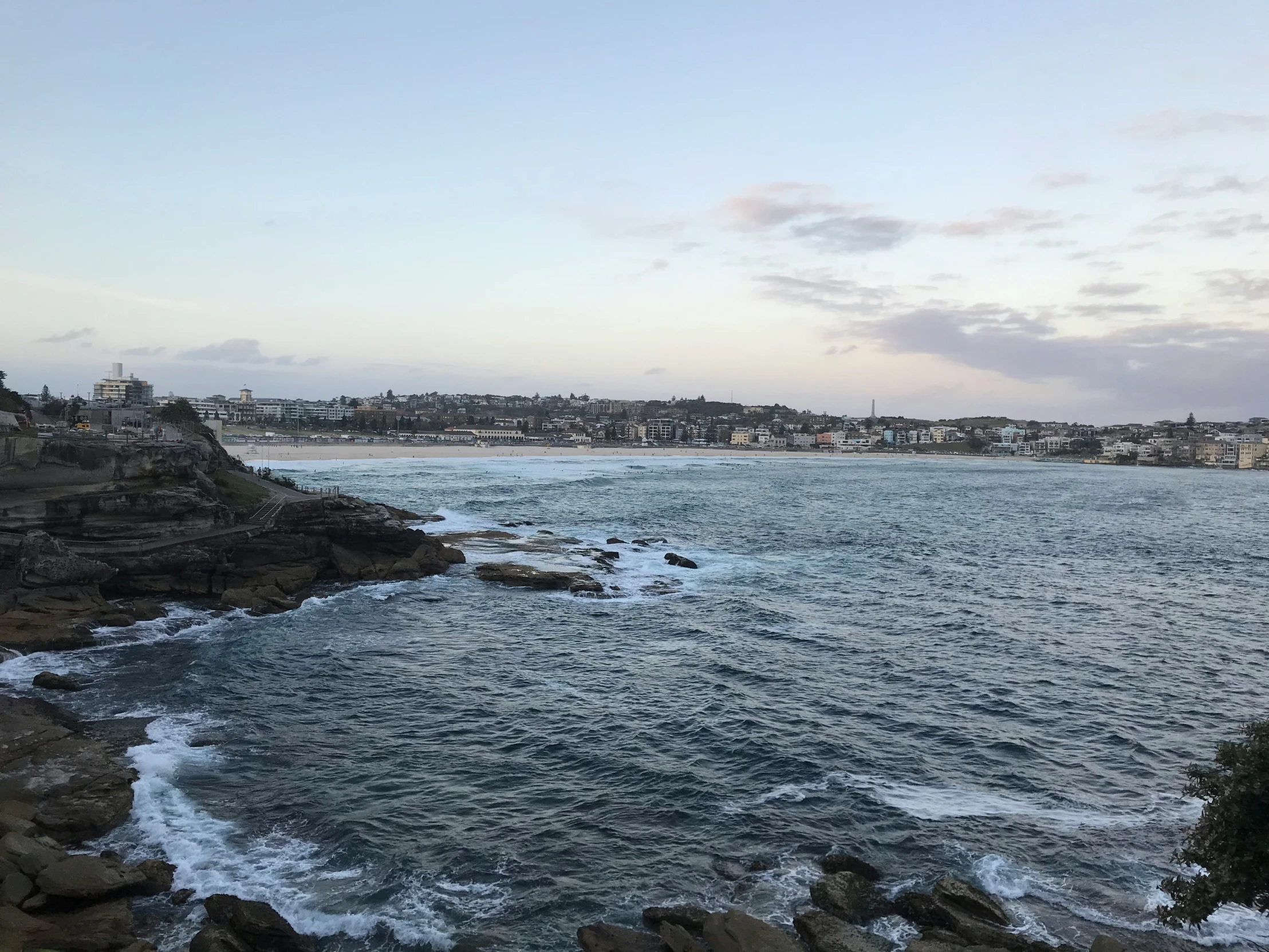 the view of some rocks and the sea