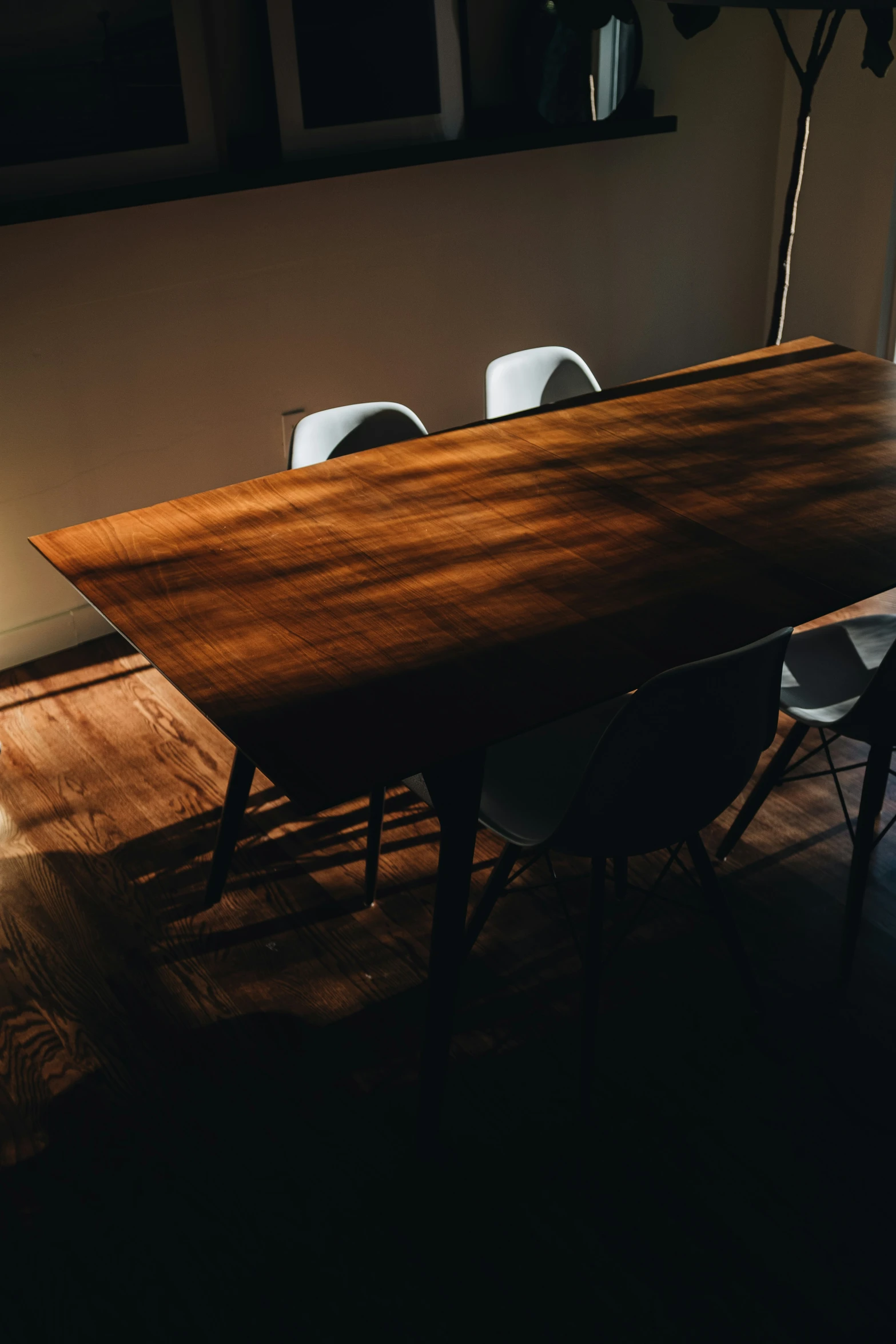 a long table with chairs sits near a doorway