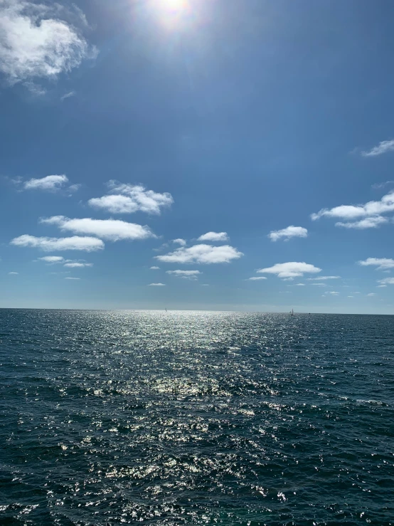 a view from the water of a boat with blue sky