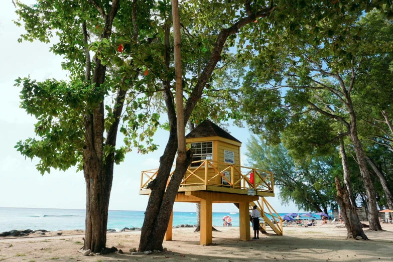 a lifeguard tower is on top of the beach