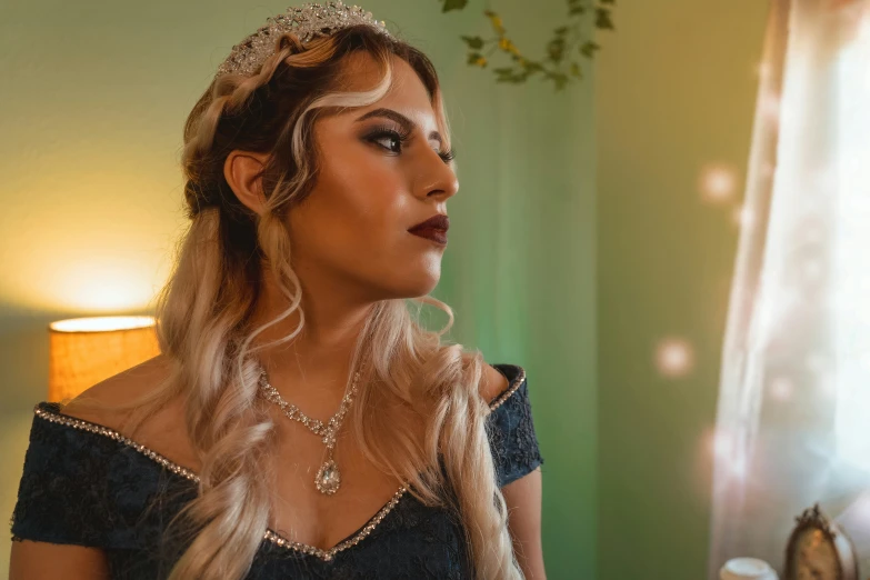 a woman with blond hair and a tiara stands in a room