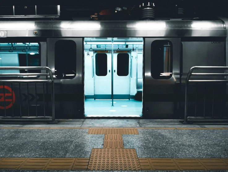 the door of an empty train car with a stop sign