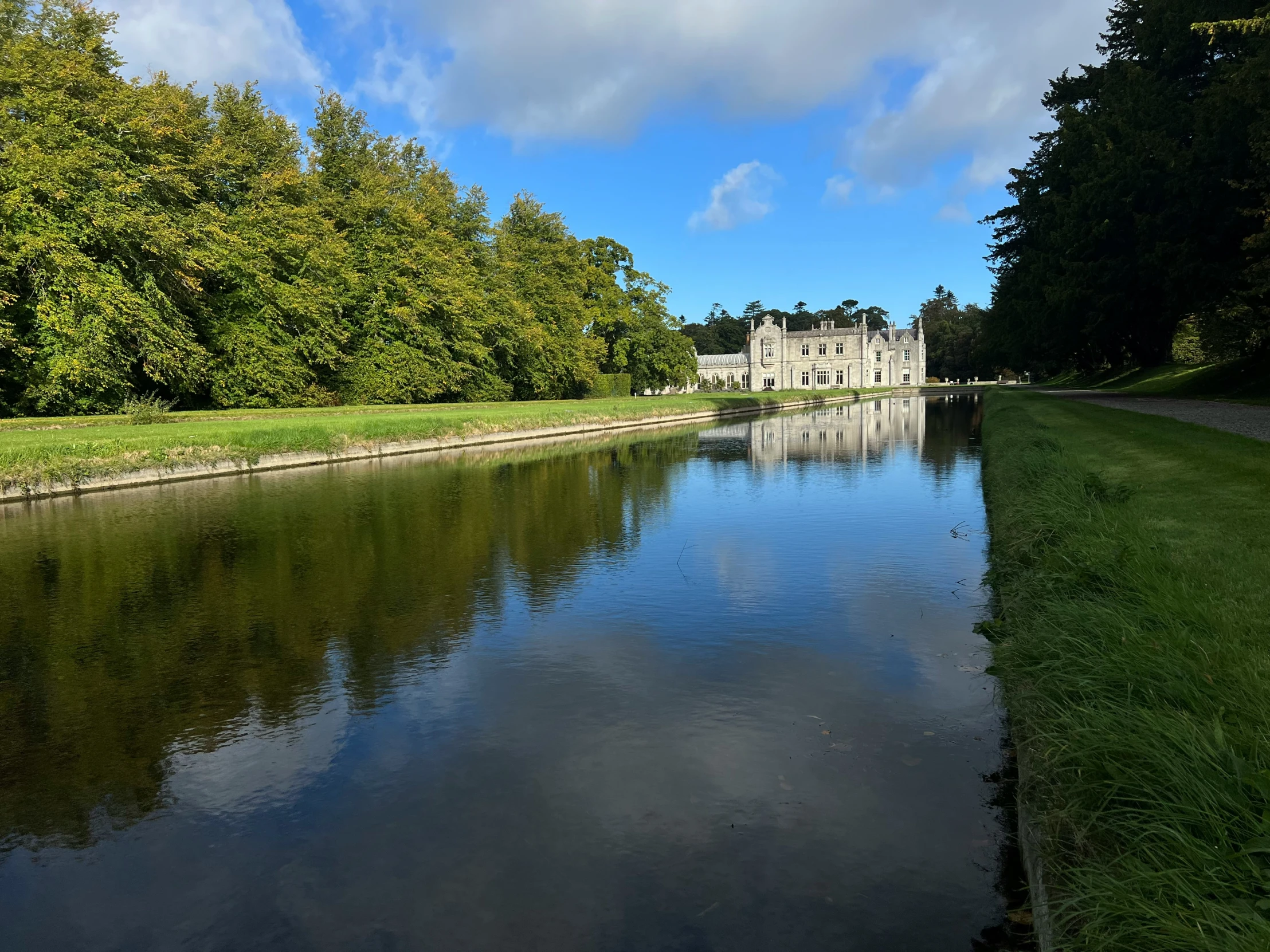 the house is sitting on the bank of a small river