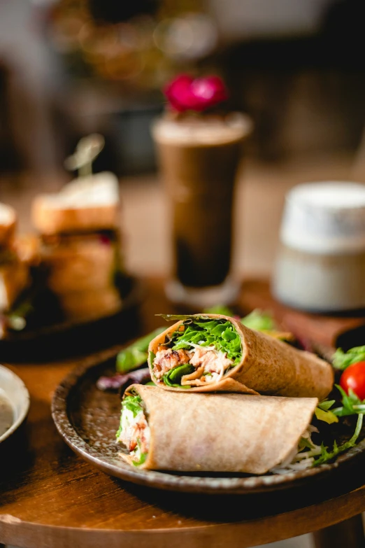 a burrito with a wrap on the top and salad