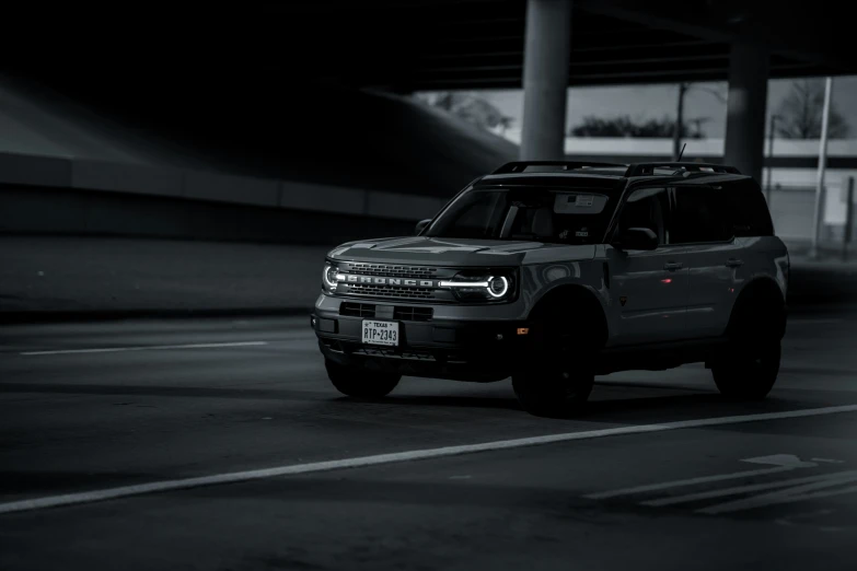 the jeep truck is in the parking garage