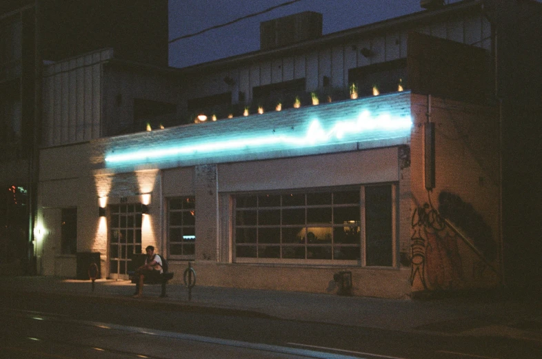 the building is lit up at night by some street lights