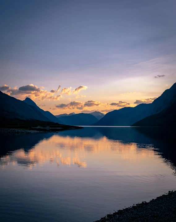 a body of water in the middle of mountains