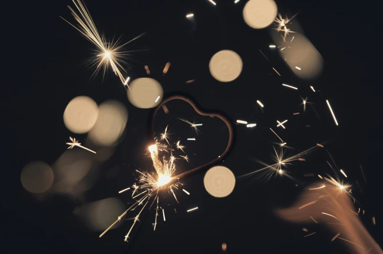 a sparkling sparkler making a heart shape