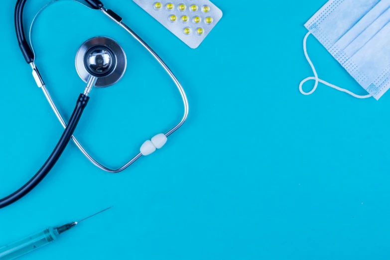 an ivg, stethoscope, and a syometer sit on a table