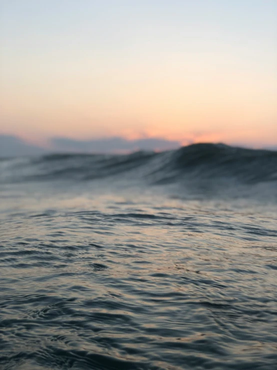 a large body of water next to a very big wave