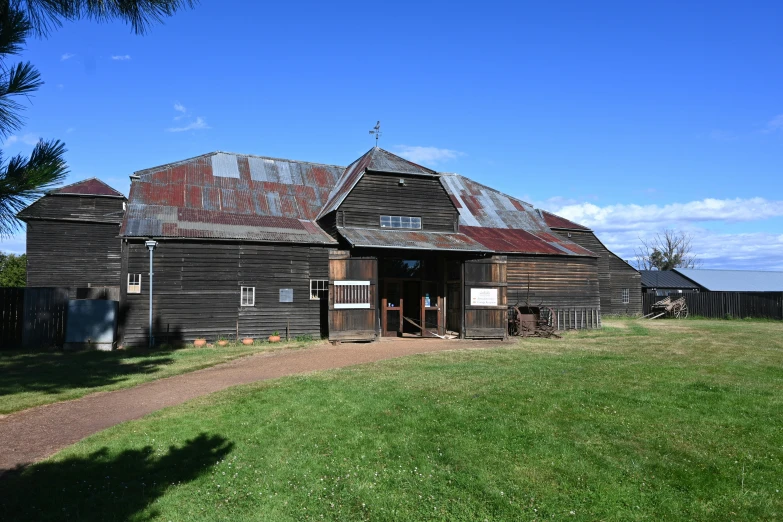 a very old building next to a field