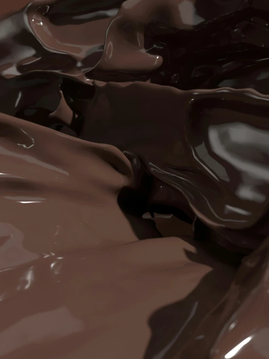 a close up of chocolate flowing across the surface