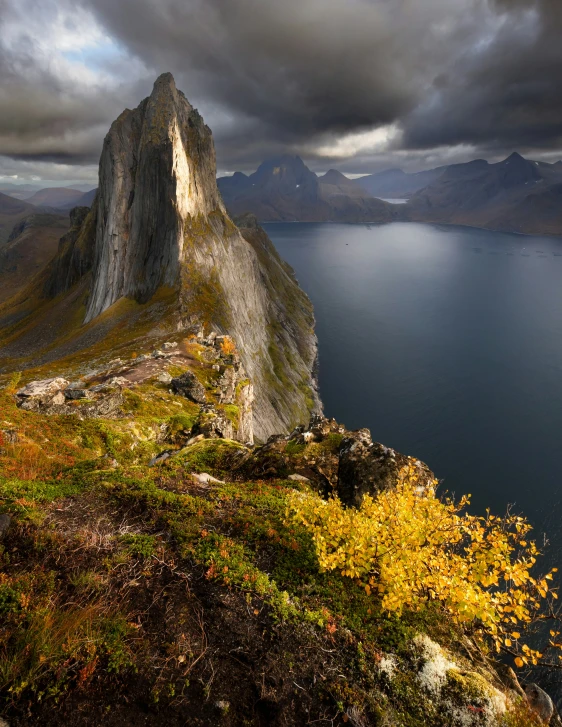 a view from top of a hill with some water and land