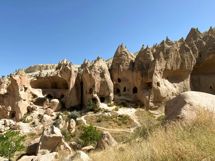 a hill with large rocks and many smaller rocks in it