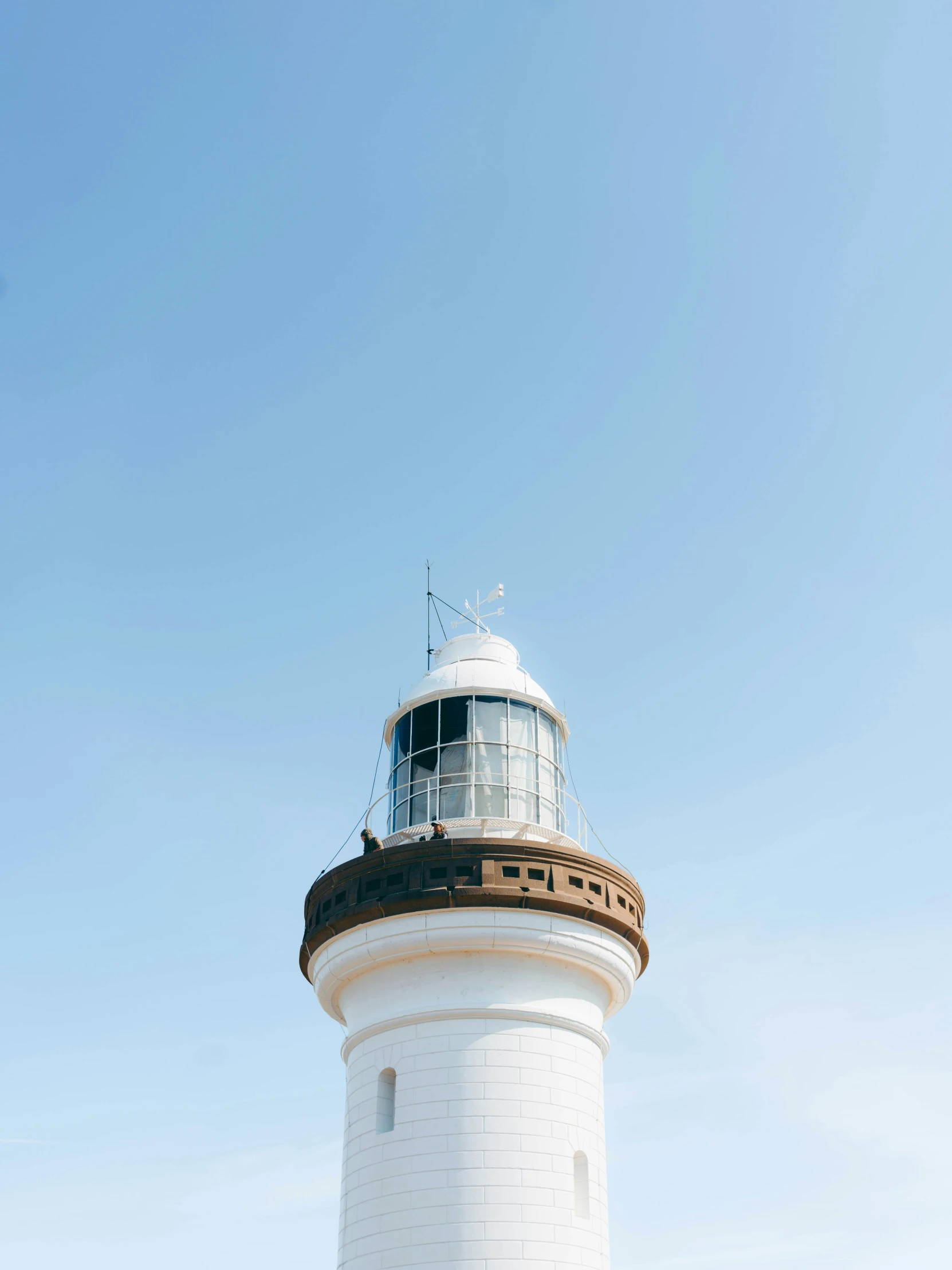 a lighthouse tower is on top of the building