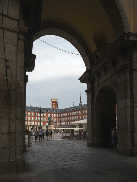 a tall building with a clock tower towering over it's head