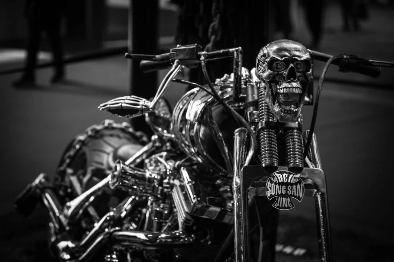 a motorcycle with a skeleton skull parked on the street