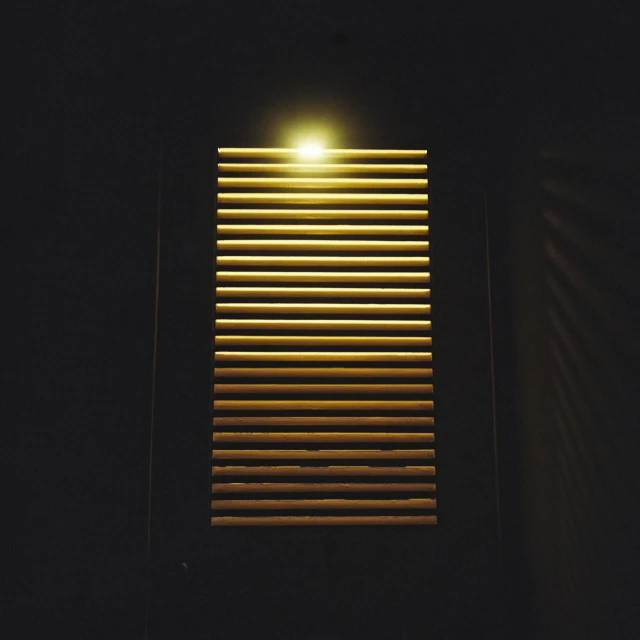 a close up image of a light on a window