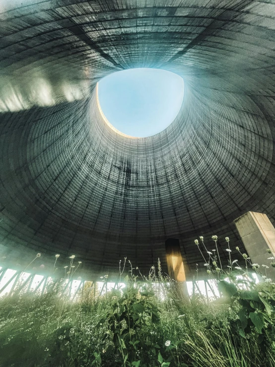 the sun is shining inside of a round structure