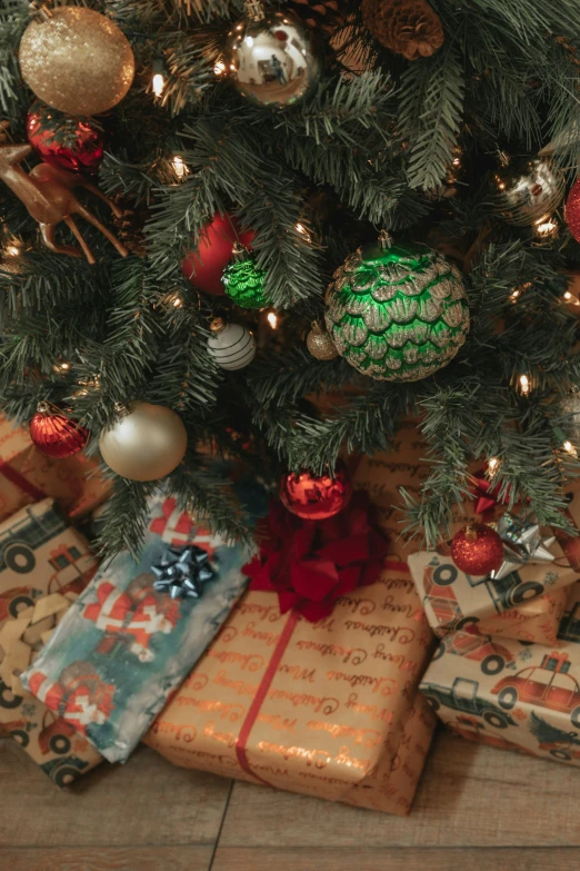 presents under the tree with a red ribbon