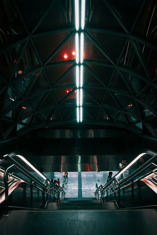 escalators and stairs leading into a building