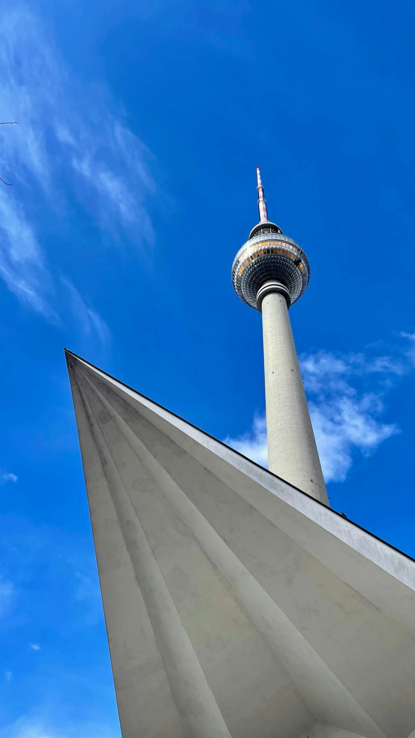 an odd view of the tower against the blue sky